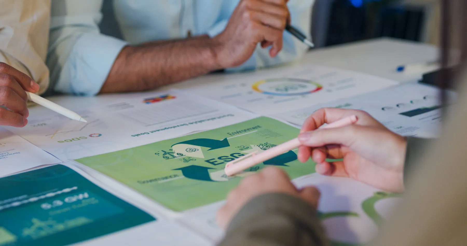 Business professionals discussing ESG strategies and risk management.